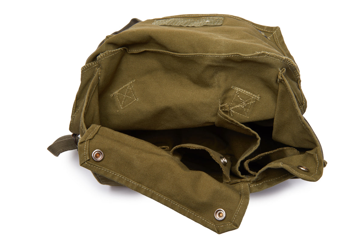 Green backpack on a white background