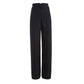 Navy bell bottom pants with button details on a white background