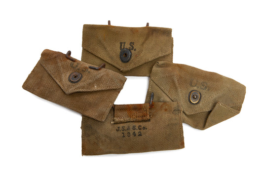 Brown military pouches with U.S. markings on a white background
