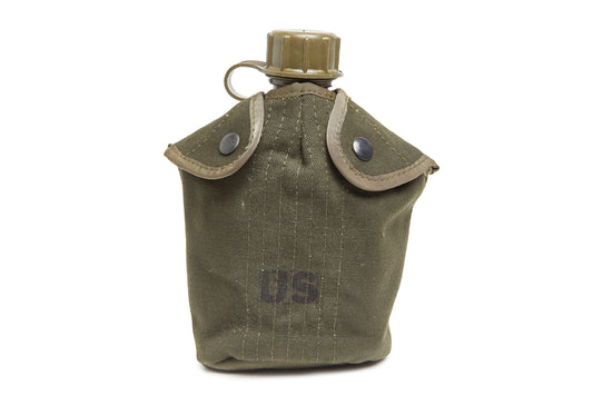 Green military canteen cover with US marking and water bottle on a white background
