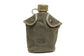 Green military canteen cover with US marking and water bottle on a white background