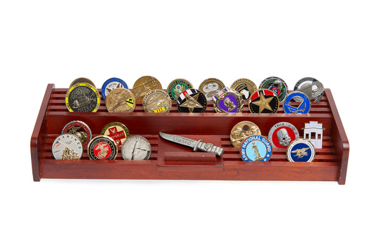 Wooden display rack with various challenger coins on a white background