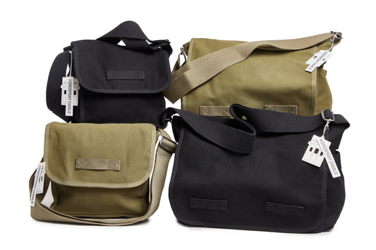 Four bags in black and olive green on a white background