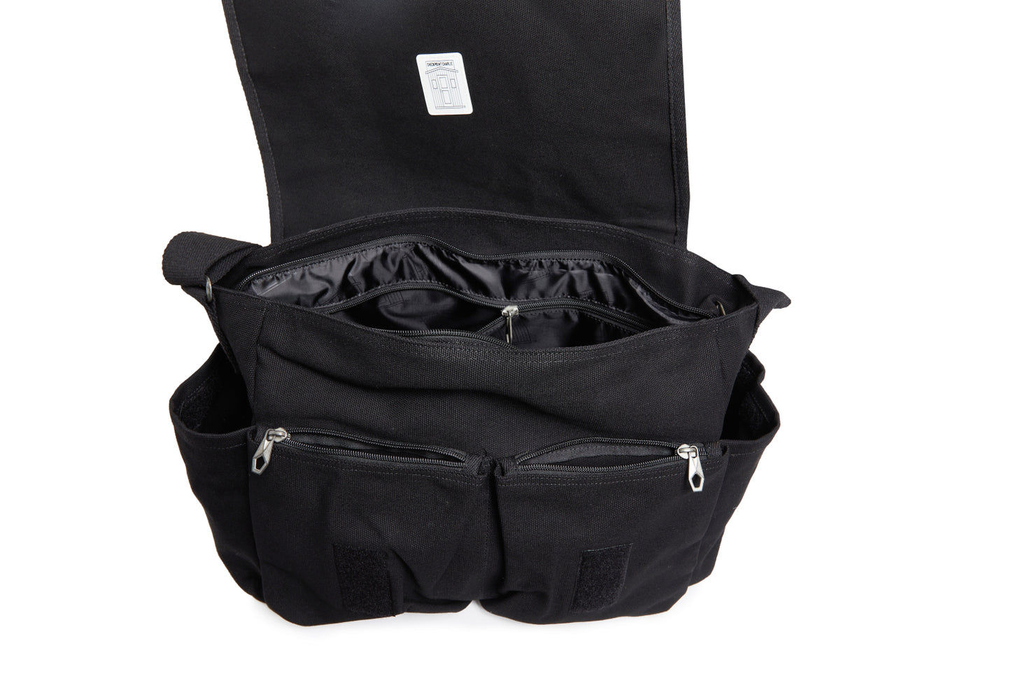 Black bag with open compartments on a white background