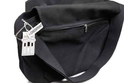 Black bag with a 'Check Point' tag on a white background
