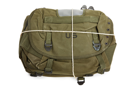 Olive green military-style bag with 'US' logo on a white background