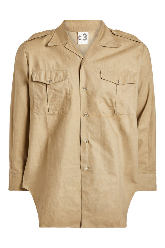 Beige shirt with two front pockets on a white background