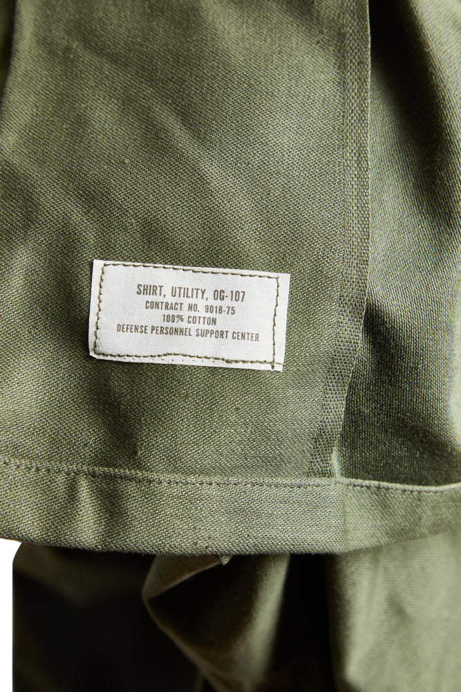 Close-up of a green shirt with a label on the interior.