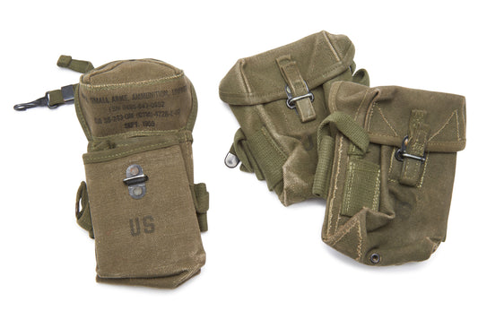 Three green military pouches with 'US' marking on a white background
