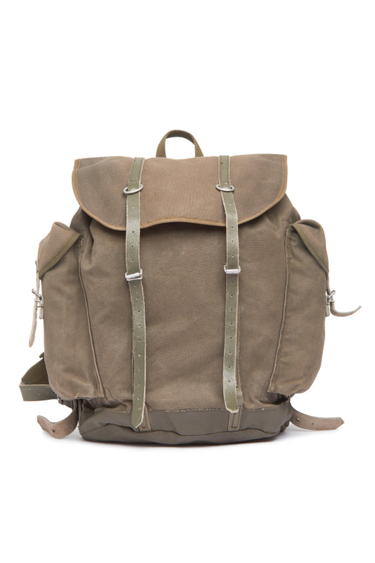Brown backpack with leather straps on a white background