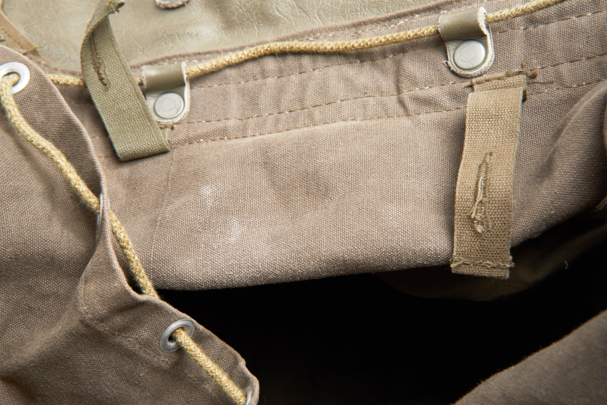 Close-up of a brown leather bag with stitching details