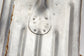 Close-up of a shovel with visible branding marking.