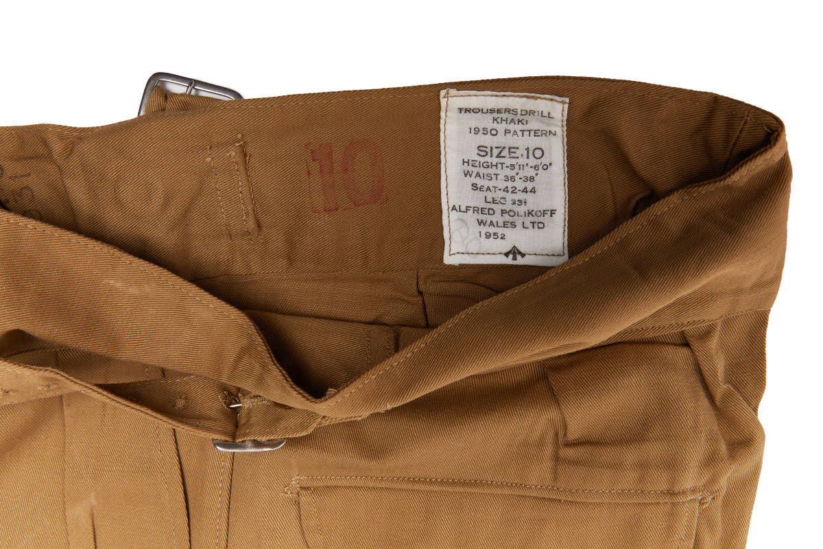 Brown pants with a visible size label on a white background