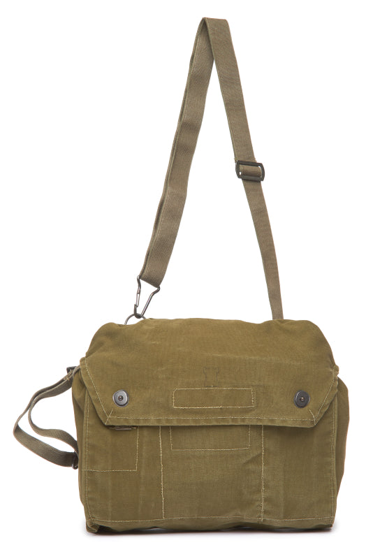 Green canvas bag with a shoulder strap on a white background