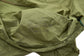 Close-up of a military-style pouch with branding marking